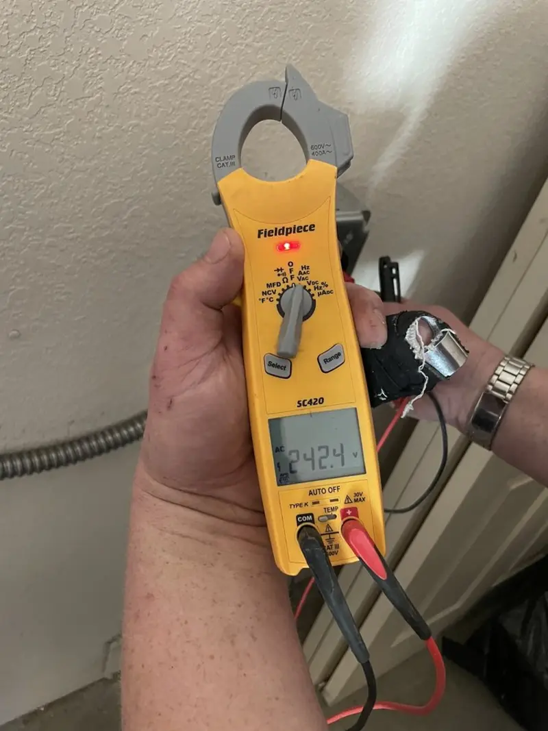 Voltage testing with clamp meter during Generator Installation in Cross Plains